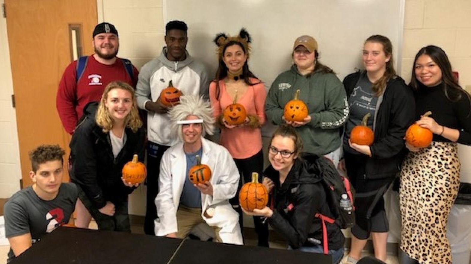 Students in the Department of Mathematics, Physics, and Computer Science participate in a Pumpkin contest at Halloween